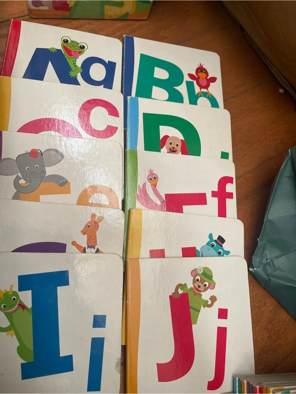 Disney Baby Einstein Alphabooks Board Book Set - Blue, Green, Pink, Teal